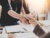 Business women shaking hands